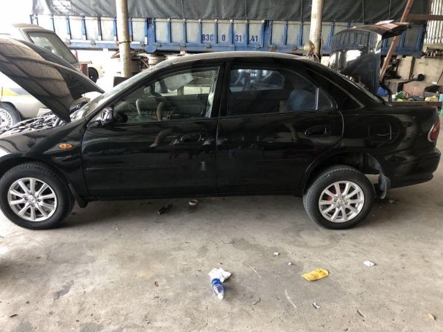 Cần bán lại xe Mazda 323 năm 1997, màu đen, nhập khẩu nguyên chiếc giá cạnh tranh0