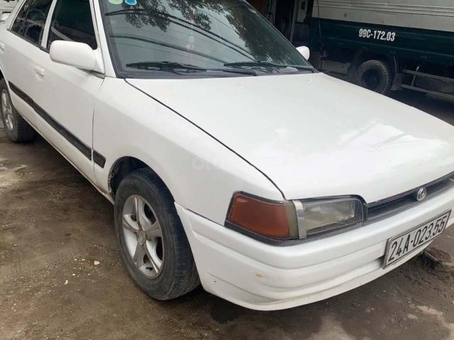 Cần bán gấp Mazda 323 đời 1994, màu trắng, xe nhập Nhật0