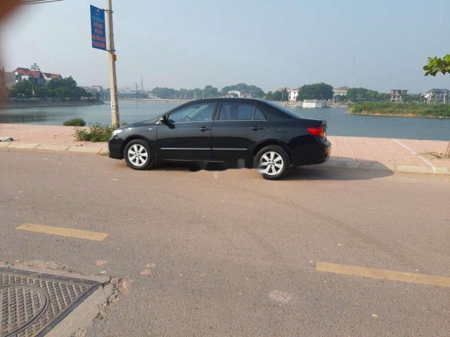 Cần bán gấp Toyota Corolla Altis đời 2010, màu đen0