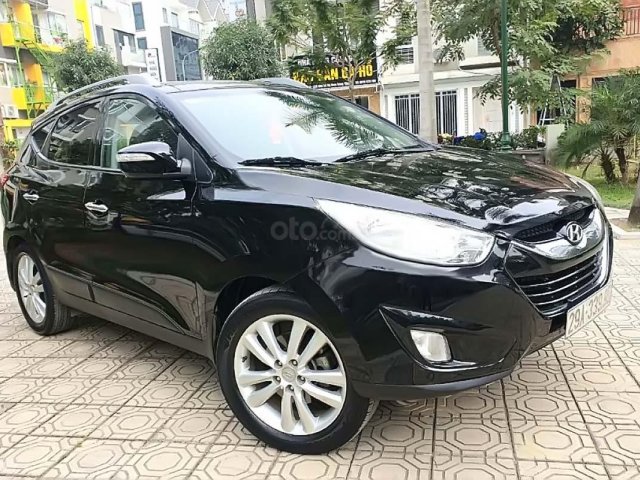 Cần bán xe Hyundai Tucson 2.0 AT 4WD đời 2011, màu trắng, nhập khẩu nguyên chiếc số tự động0