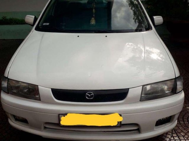 Gia đình cần bán nhanh chiếc Mazda 323 sản xuất 2002 số sàn, xe còn mới 