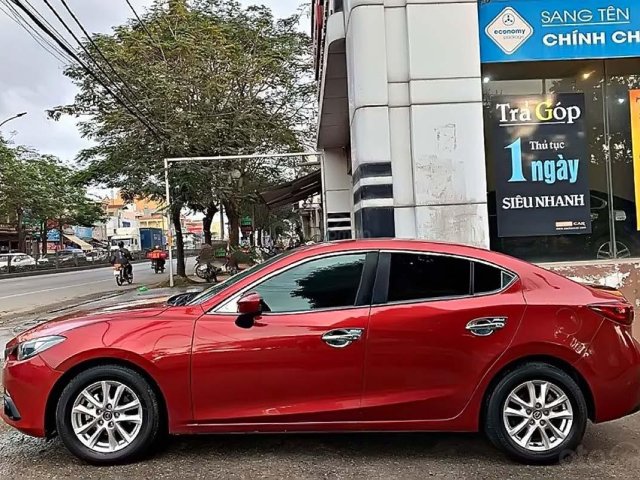 Cần bán xe Mazda 3 1.5 AT sản xuất 2015, màu đỏ0