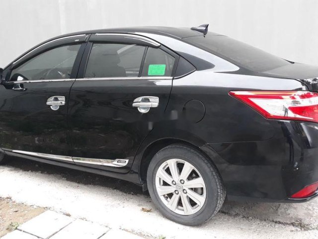 Cần bán gấp Toyota Vios đời 2015, màu đen xe gia đình, 405 triệu0