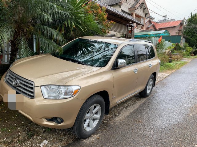 Gia đình bán xe Toyota Highlander năm 2010, màu vàng, xe nhập