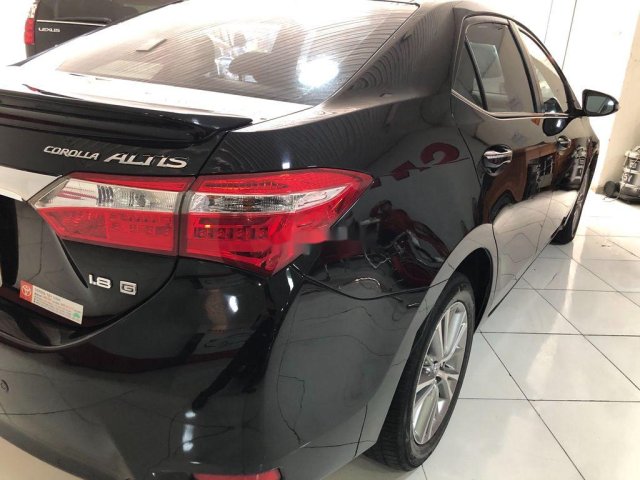 Cần bán lại xe Toyota Corolla Altis 2015, màu đen