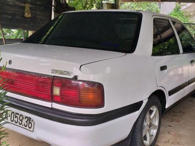 Bán xe Mazda 323 sản xuất năm 1997, màu trắng0