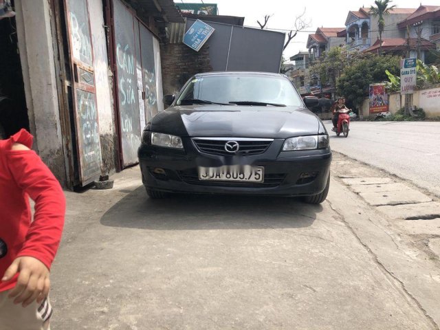 Cần bán Mazda 626 đời 2002, màu đen