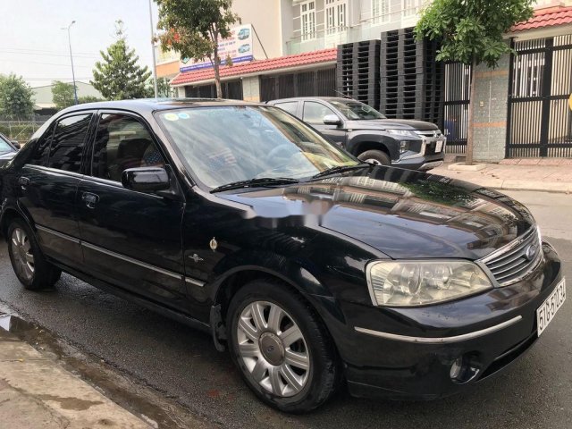 Cần bán xe Ford Laser năm 2004, màu đen0