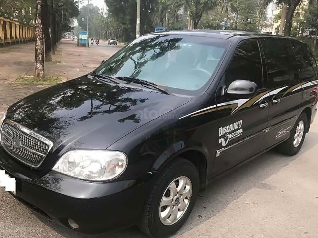 Cần bán xe Kia Carnival GS MT năm sản xuất 2005, màu đen, xe nhập số sàn