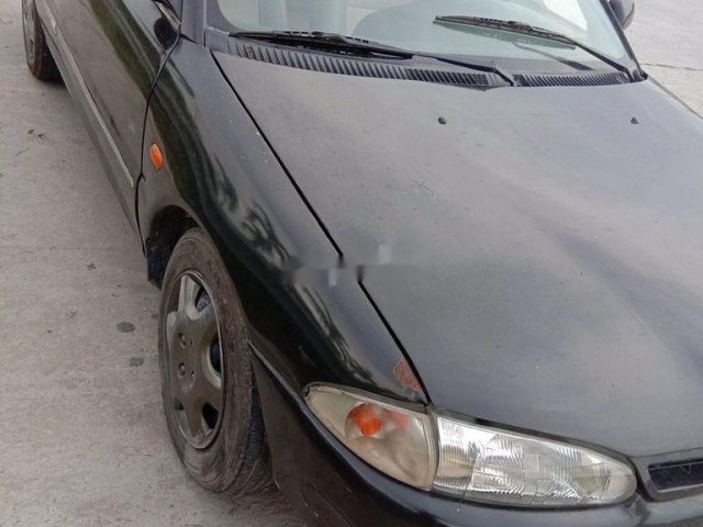 Bán xe cổ Proton Wira đời 1998, màu đen, nhập khẩu0