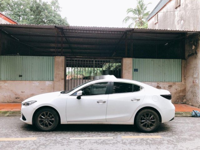 Cần bán gấp Mazda 3 đời 2016, màu trắng, chính chủ0