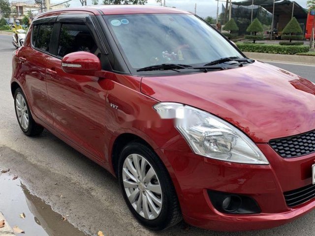 Cần bán gấp Suzuki Swift 1.4 sản xuất 2017, màu đỏ chính chủ, giá tốt0