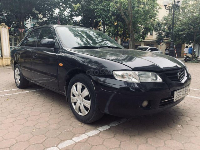 Cần bán xe Mazda 626 2.0 MT 2003, màu đen giá cạnh tranh0