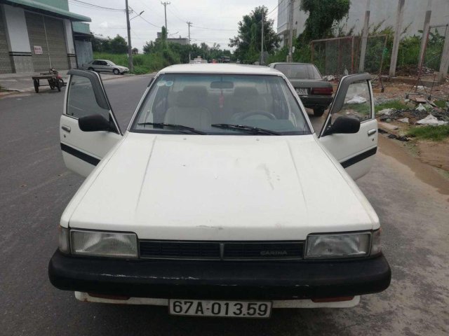 Cần tiền bán Toyota Corolla 1985, màu trắng, nhập khẩu, máy nguyên bản