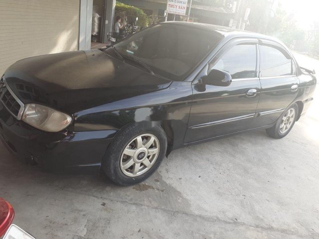 Bán xe Kia Spectra đời 2004, màu đen xe gia đình