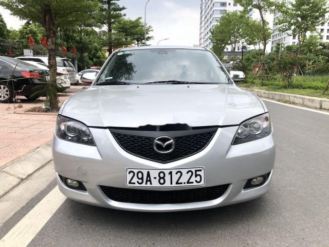 Chính chủ cần tiền bán xe Mazda 3 đời 2006, màu bạc số sàn