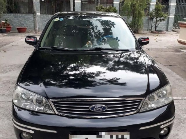 Cần bán xe Ford Laser GHIA 1.8 AT 2004, màu đen  