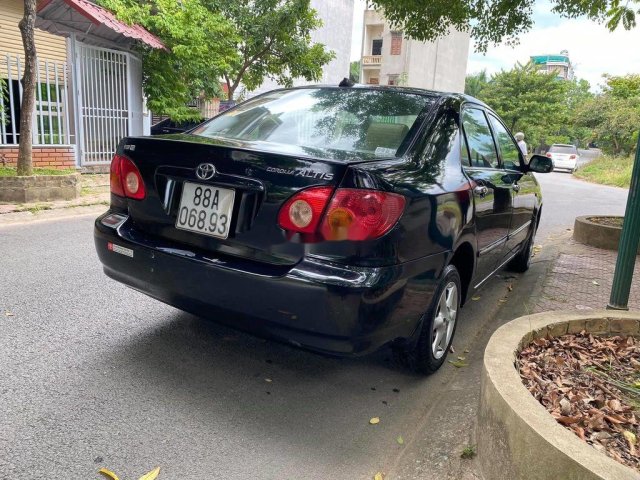 Bán Toyota Corolla Altis đời 2002, màu đen còn mới0