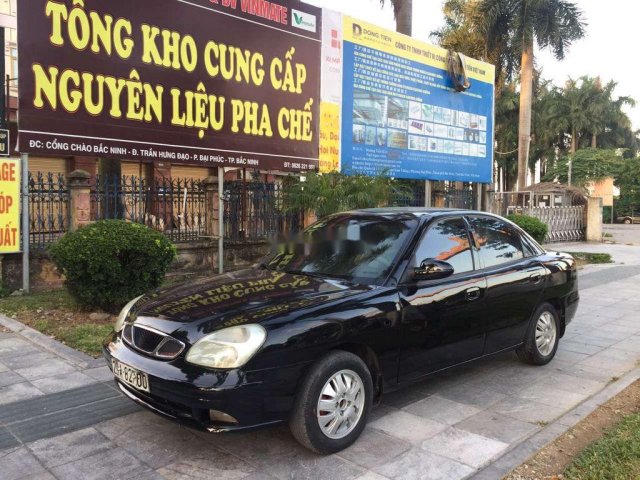 Cần bán lại xe Daewoo Nubira 2003, màu đen0