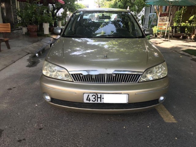 Bán Ford Laser 2003, màu vàng cát