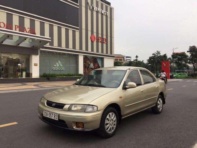 Cần bán Mazda 323 sản xuất năm 2000, màu ghi vàng 0
