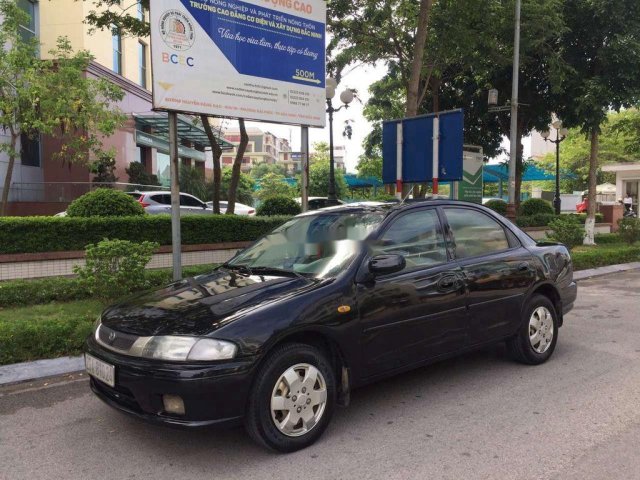 Bán xe Mazda 323 sản xuất 1999, màu đen, giá tốt0