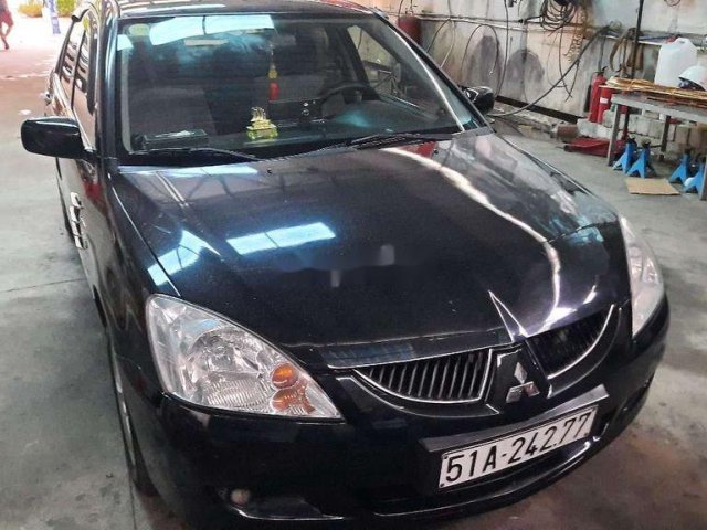 Cần bán xe Mitsubishi Lancer năm sản xuất 2003, màu đen còn mới, 165tr0