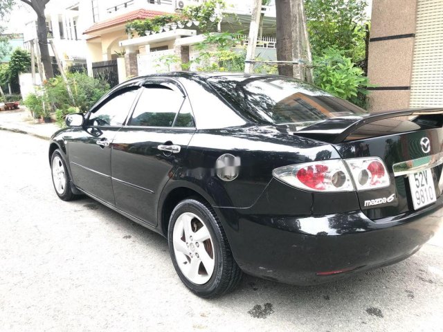 Cần bán Mazda 6 sản xuất năm 2003, màu đen, xe chính chủ sử dụng0