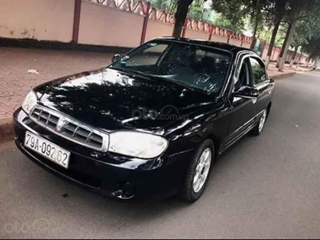 Cần bán gấp Kia Spectra đời 2005, màu đen0