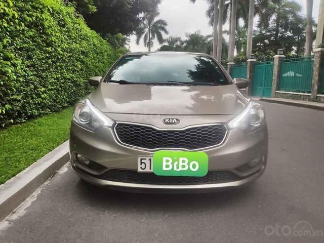 Bán Kia K3 1.6 AT đời 2015, màu vàng cát, full đồ0