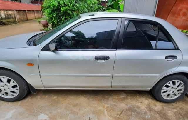 Cần bán lại xe Ford Laser LX 1.6 MT sản xuất 1999, màu bạc0