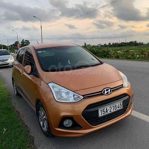 Bán ô tô Hyundai Grand i10 2015, màu vàng đồng, xe nhập xe gia đình, giá tốt