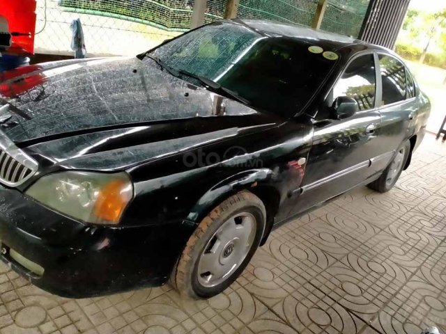 Cần bán gấp Daewoo Magnus sản xuất 2004, màu đen  