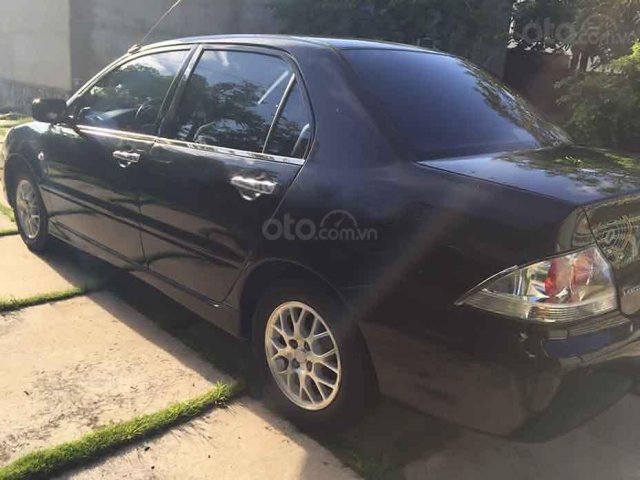 Cần bán lại xe Mitsubishi Lancer 2004, màu đen còn mới  0