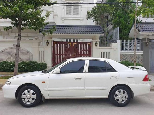 Cần bán Mazda 626 2002, màu trắng chính chủ0