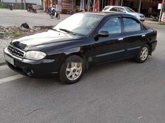 Bán Kia Spectra đời 2004, màu đen, xe nhập, giá 85tr0