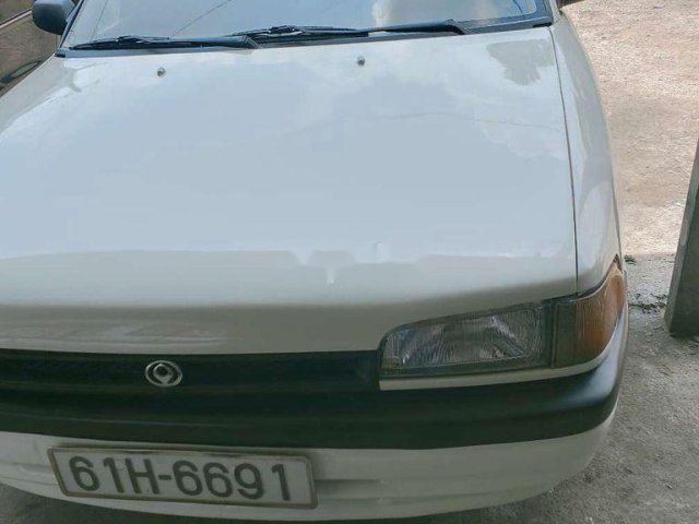 Cần bán gấp Mazda 323 đời 1995, màu trắng