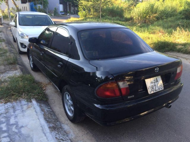 Bán Mazda 323 1.6MT năm sản xuất 1999, màu đen, xe nhập