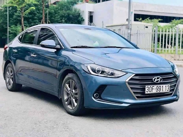 Cần bán xe Hyundai Elantra 1.6 AT đời 2016, màu xanh lam còn mới0