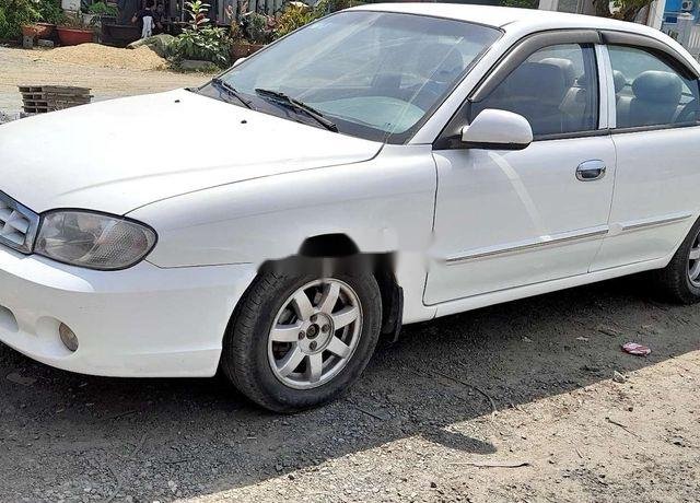 Cần bán xe Kia Spectra sản xuất năm 2005, màu trắng0