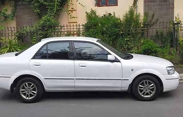 Cần bán gấp Ford Laser Deluxe đời 2003, màu trắng còn mới 