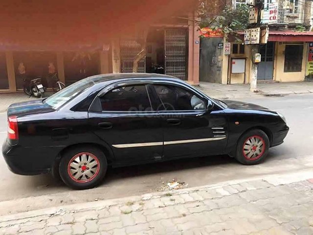 Bán gấp Daewoo Nubira năm sản xuất 2002, màu đen còn mới 0