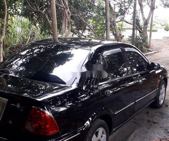 Cần bán Ford Laser năm 2002, màu đen, xe nhập0