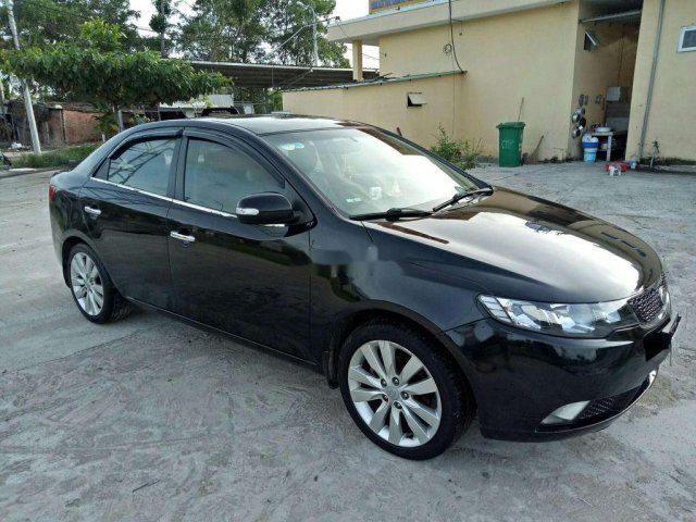 Cần bán gấp Kia Cerato sản xuất năm 2010, màu đen, nhập khẩu nguyên chiếc, giá 310tr0