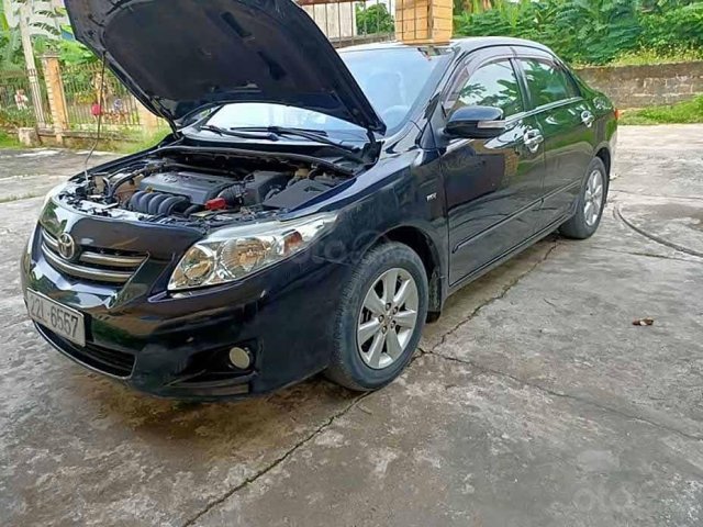 Cần bán gấp Toyota Corolla Altis đời 2010, màu đen còn mới 0