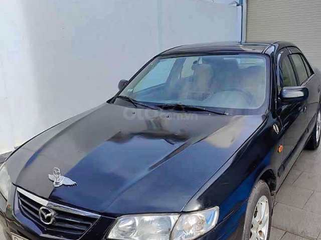 Cần bán lại xe Mazda 626 đời 2001, màu đen còn mới0