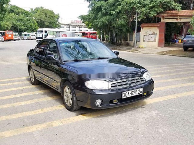 Cần bán Kia Spectra đời 2004, màu xanh lam, xe chính chủ, giá chỉ 97 triệu0