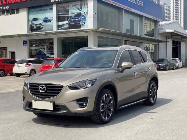 Cần bán xe Mazda CX 5 SX 2016 màu vàng cát, đi 40 000km
