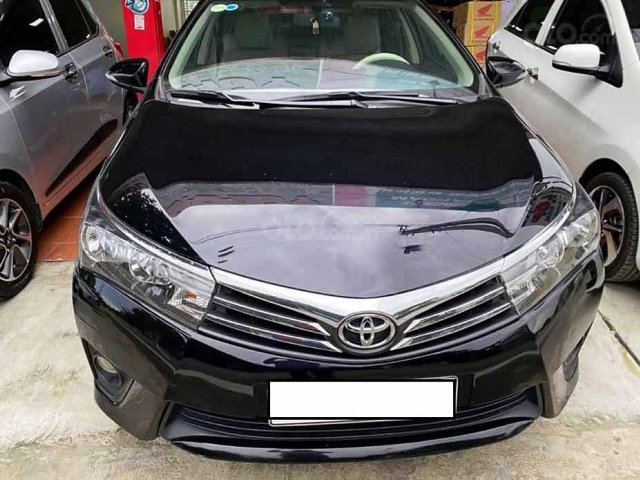 Bán Toyota Corolla Altis năm 2014, màu đen còn mới0