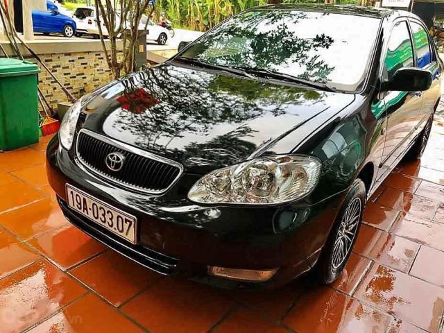 Cần bán gấp Toyota Corolla Altis năm 2003, màu đen còn mới, giá tốt0